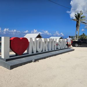 A large sign that says 'I ❤️ NORTH SIDE' with a person standing nearby.