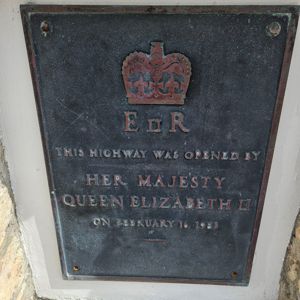 A plaque commemorating the opening of a highway by Queen Elizabeth II.