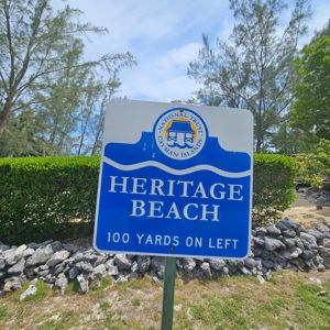 Sign indicating the direction to Heritage Beach.